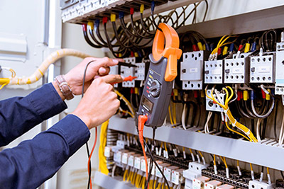 electrician-testing-electric-current-control-panel_small.jpg